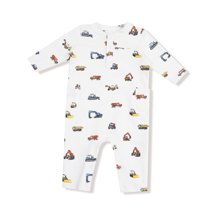 White baby onesie with construction vehicle pattern on a white background