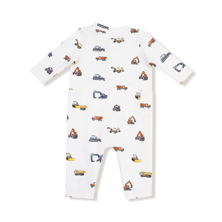 White baby onesie with construction vehicle pattern on a white background