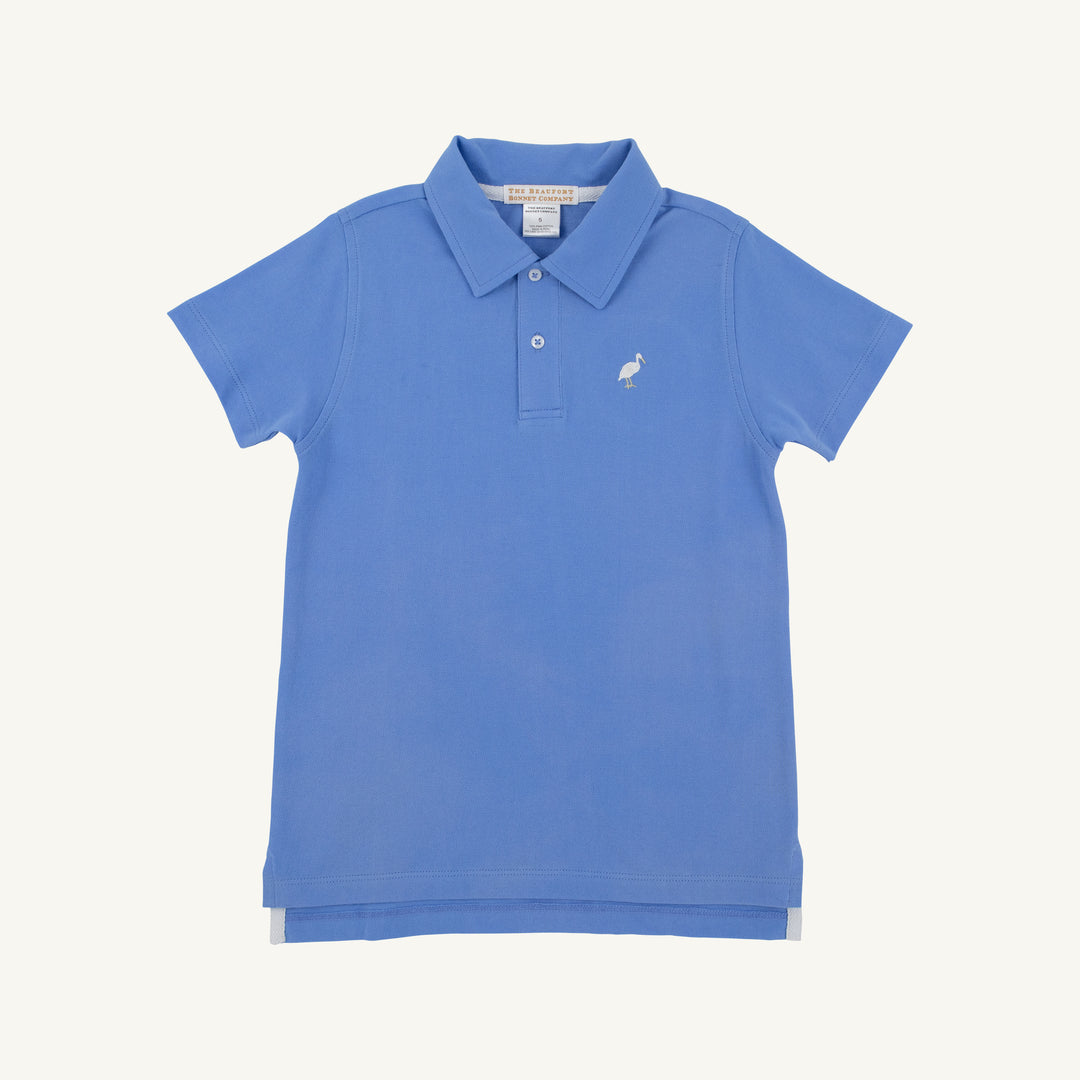 BOYS BLUE SHORT SLEEVE POLO ON WHITE BACKGROUND