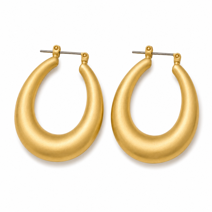 Gold hoop earrings on a white background