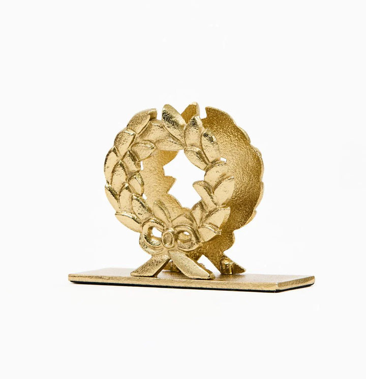 Gold wreath napkin holder on a white background
