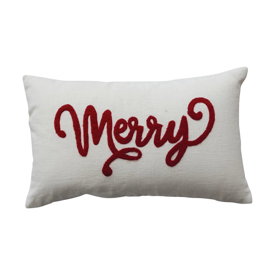 White pillow with red 'Merry' text on a white background