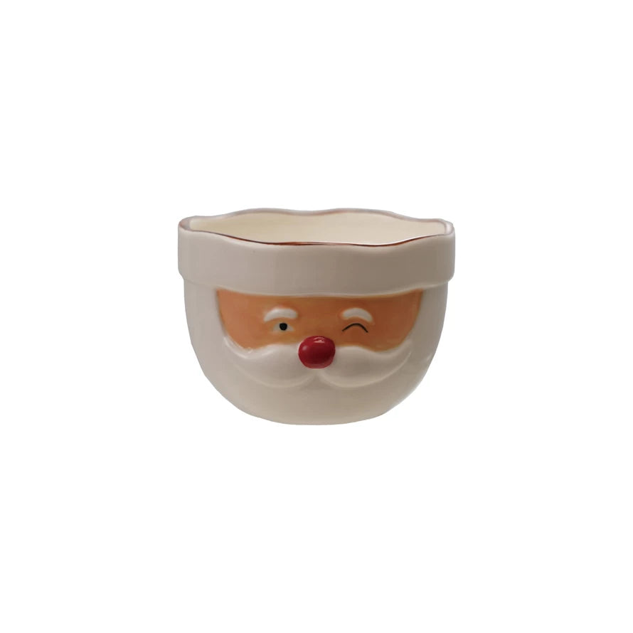 Ceramic bowl with a Santa Claus face design on a white background
