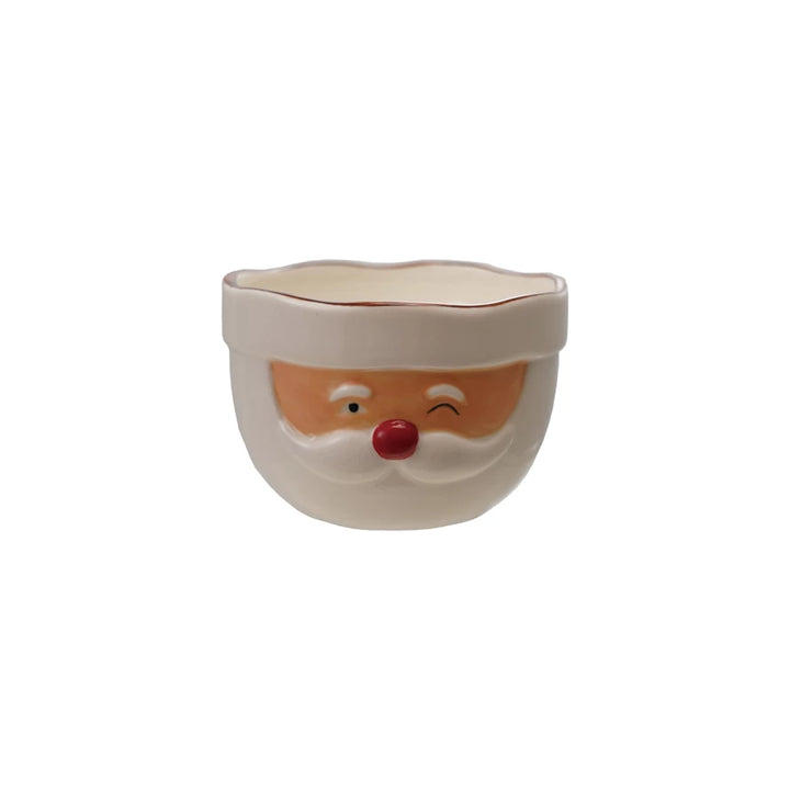 Ceramic bowl with a Santa Claus face design on a white background