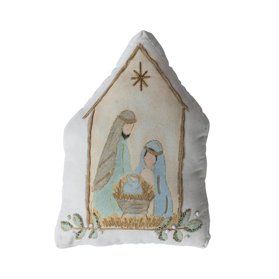 Decorative pillow with nativity scene design on a white background