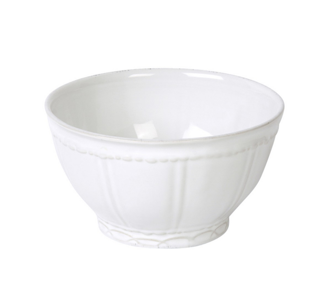 A white ceramic cereal bowl with a simple design and a slight sheen, likely made of stoneware.