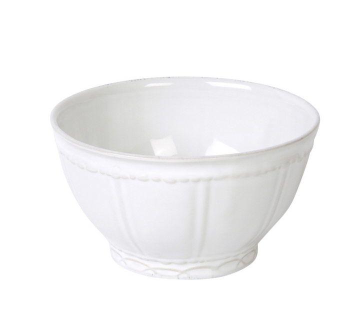 A white ceramic cereal bowl with a simple design and a slight sheen, likely made of stoneware.