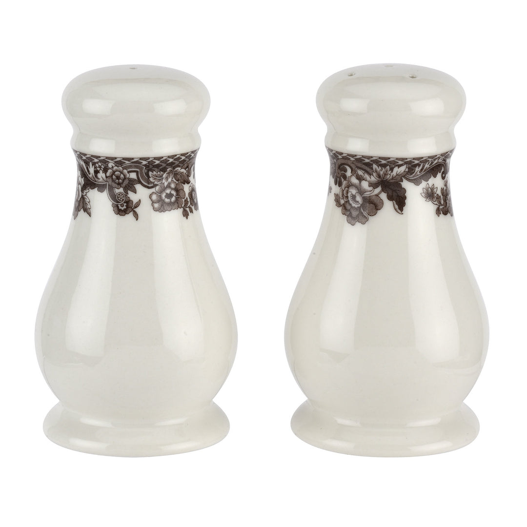 A pair of Delamere salt and pepper shakers with a rich brown floral and scroll border on a white background.