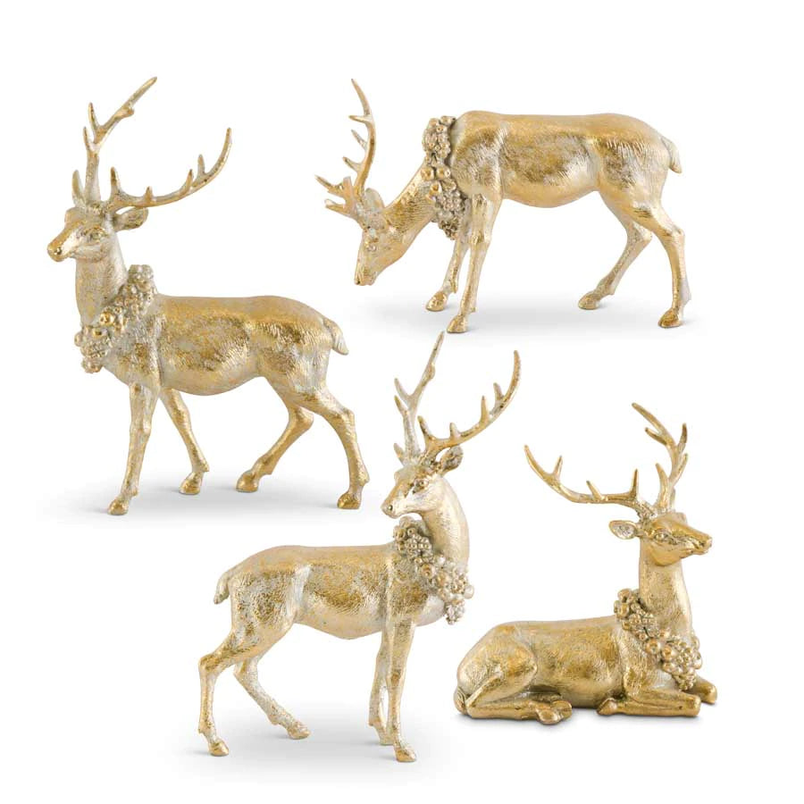 A collection of gold-colored reindeer statues in various poses designed for Christmas decor.