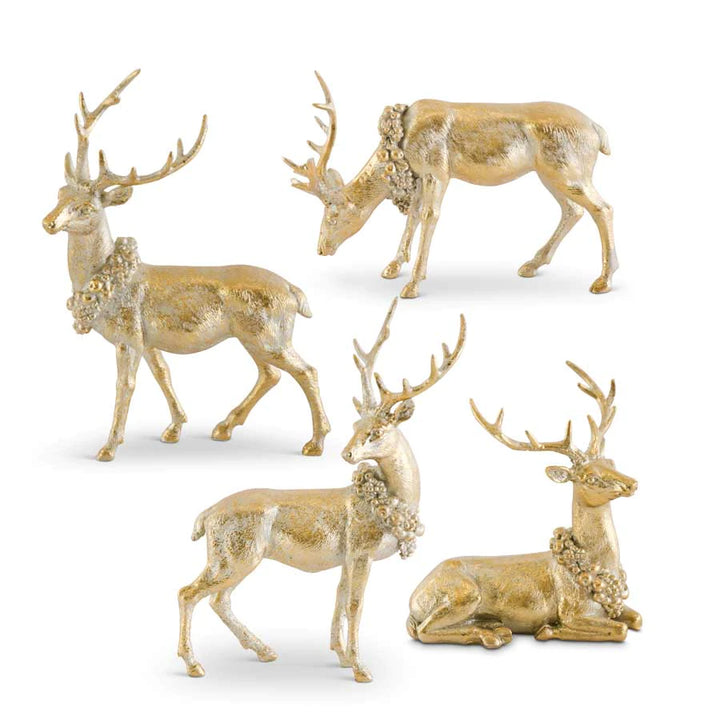 A collection of gold-colored reindeer statues in various poses designed for Christmas decor.