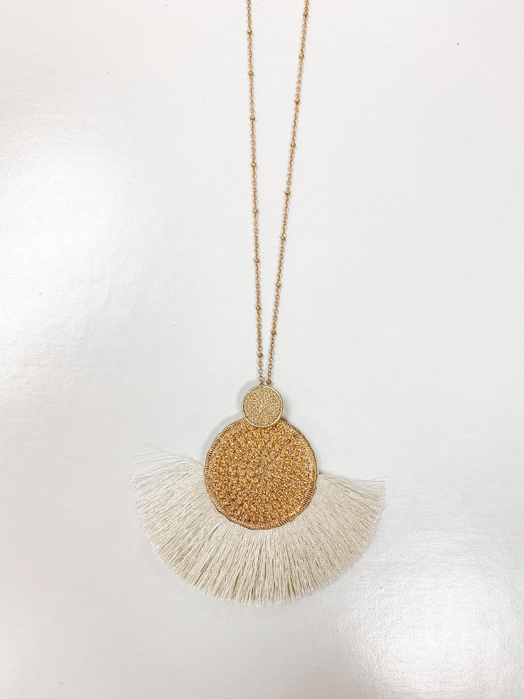 IVORY WOVEN METAL DISC TASSEL NECKLACE