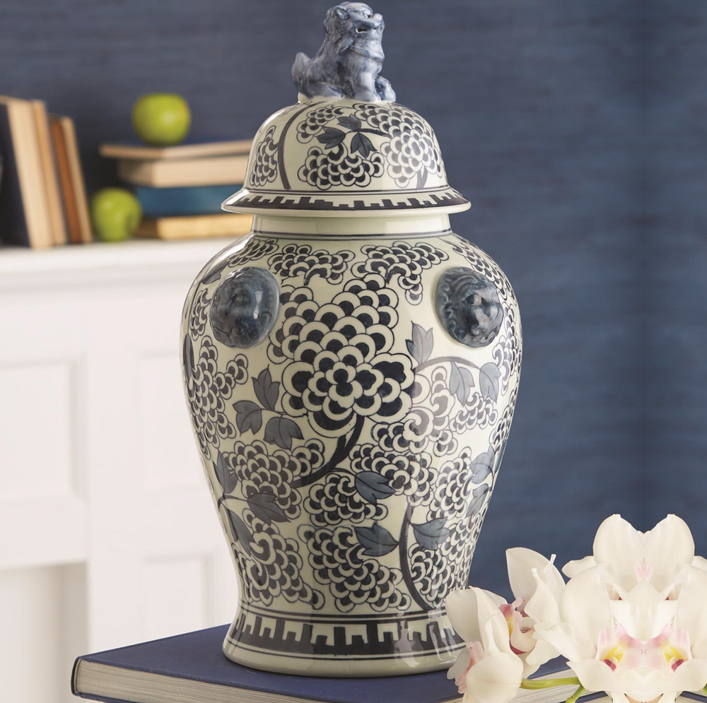 blue & white jar on book