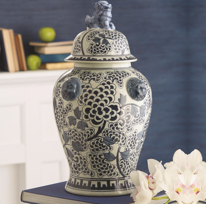 blue & white jar on book