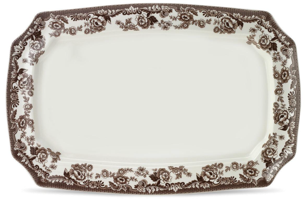 A rectangular brown and white ceramic platter with a floral and scroll pattern around the border.