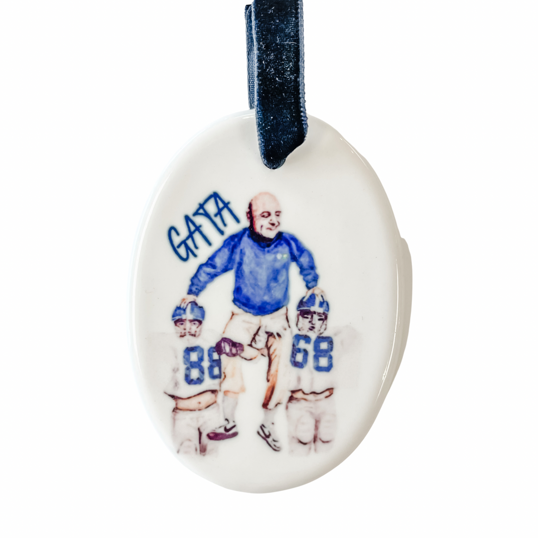 oval erk russell ornament sitting on the shoulder of 2 players