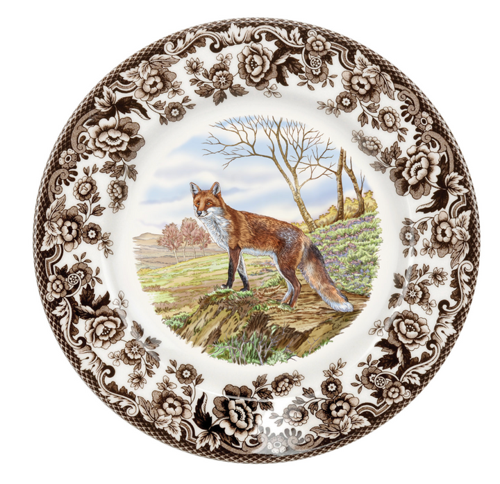brown floral edge on salad plate with fox in center on white background